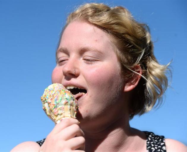 Hannah Twigg from Dunedin enjoys an ice cream in the heat on Albany St yesterday. PHOTO: LINDA ROBERTSON 