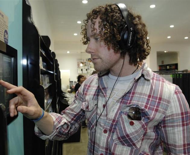 Russell Mackintosh, of Wanaka, uses a digital listening post at Marbecks yesterday.