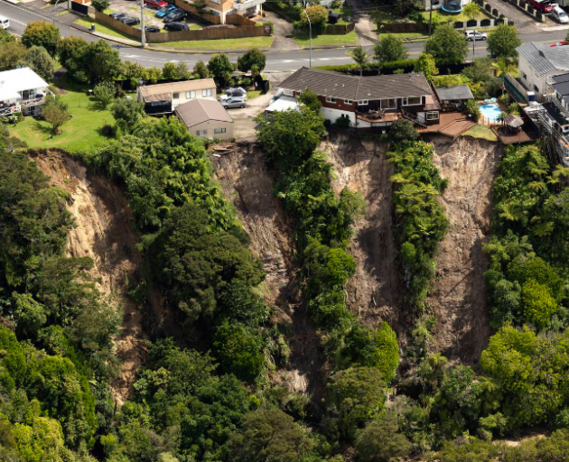 Hanging on the edge: Landslides threaten homes on Colwill Rd, Massey.  Photo: Brett Phibbs/NZ...