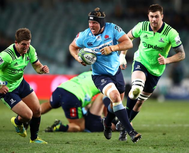 Damien Fitzpatrick of the Waratahs makes a break during a horror six minute period of the second...