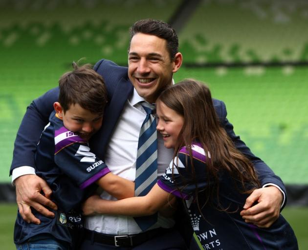 Billy Slater embraces his children, Jake and Tyla Rose, after announcing his retirement at AAMI...