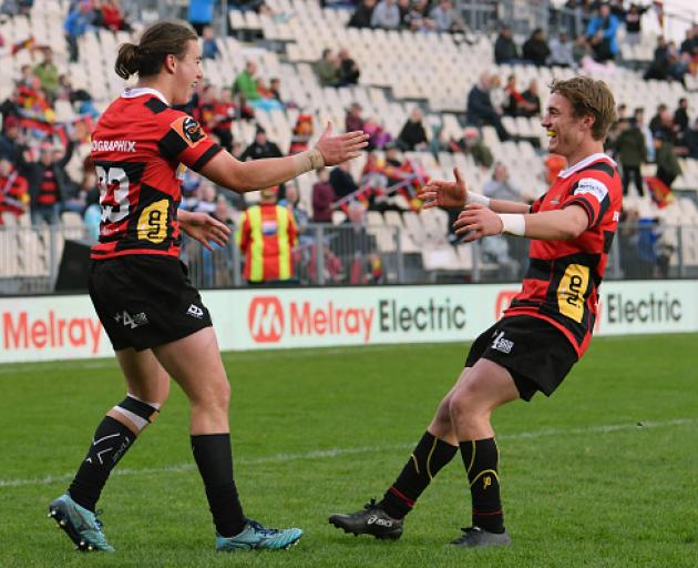 Connor Garden-Bachop is congratulated by Connor Collins during the Mitre 10 Cup match between...