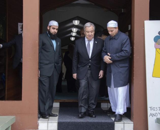 UN Secretary General Antonio Guterres (centre) visits with members of the Al Noor Mosque. Photo:...