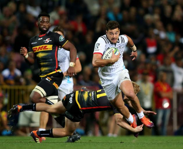 Crusaders player David Havili gets past Justin Phillips of the Stormers at Newlands. Photo: Getty...