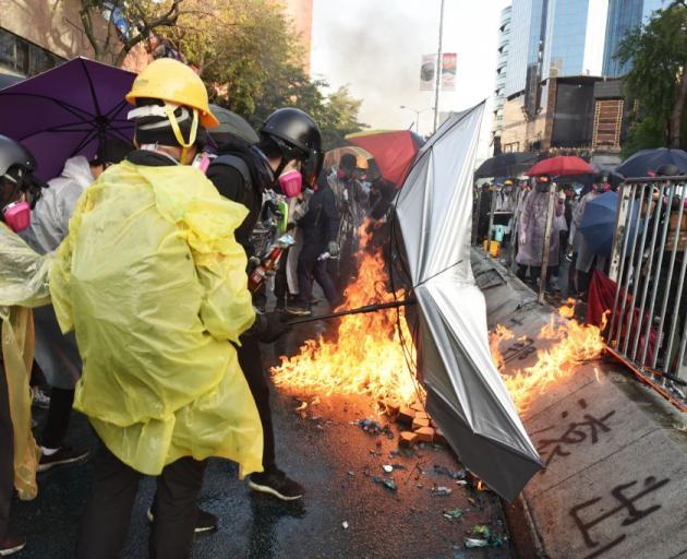 Protesters clash with police during confrontations at the Polytechnic University in Hong Kong on...