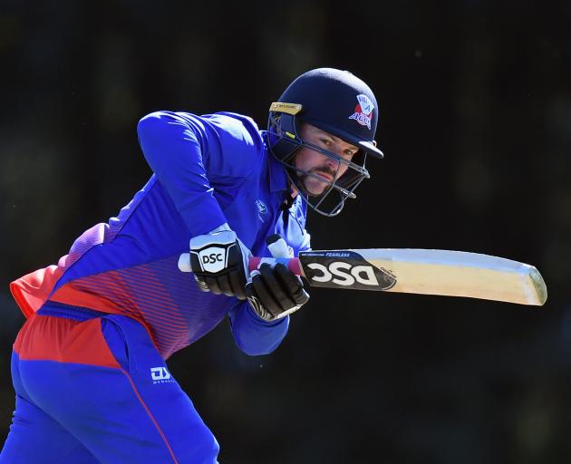 Colin Munro clobbered a quickfire hundred to ease the pressure on Auckland in their chase. Photo:...