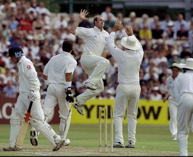 Chris Harris celebrates after bowling England's Chris Read during the third Test match between...