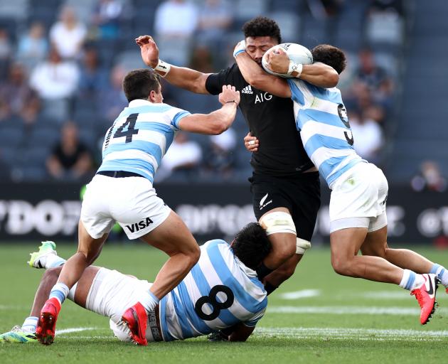 Ardie Savea is enveloped by the Argentine defence. Photo: Getty Images