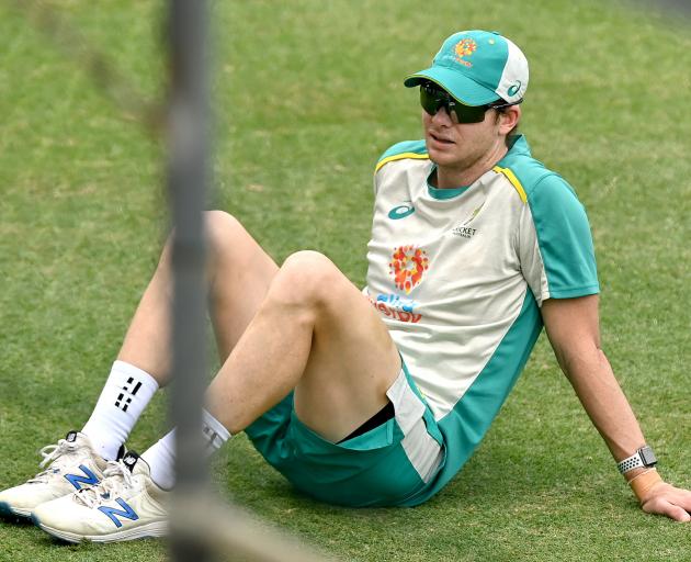 Australian batsman Steve Smith takes a breather during a nets session at The Gabba, in Brisbane,...