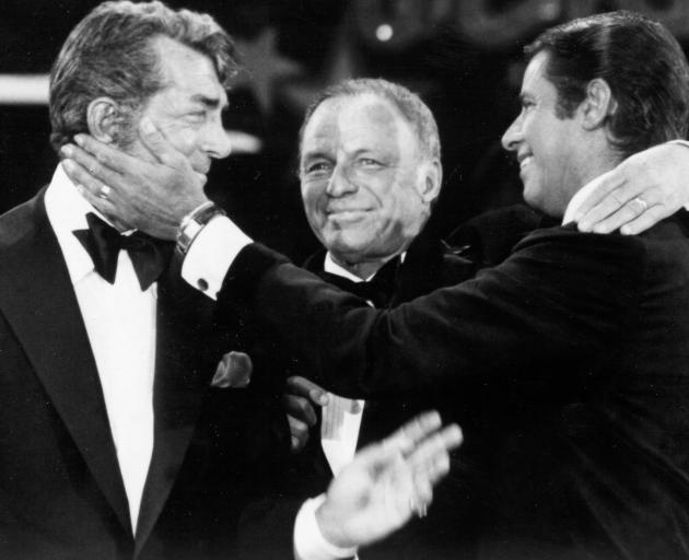 Singers Dean Martin (left), Frank Sinatra and Jerry Lewis perform during the 1976 telecast of The...