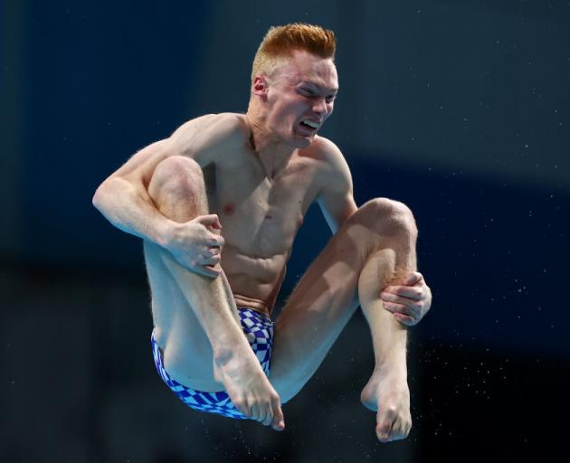 New Zealander Liam Stone competes in the men’s 1m springboard preliminaries.