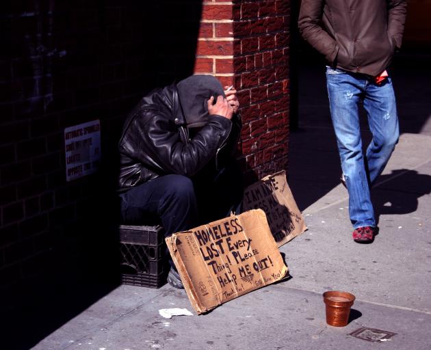 A homeless man begs for money on a New York street. Photo: Getty Images