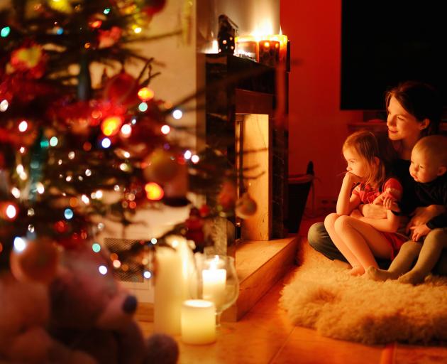 Consider ways in which you and your children can share the love, the hope and the goodwill that underlies Christmas. Photo: Getty Images 