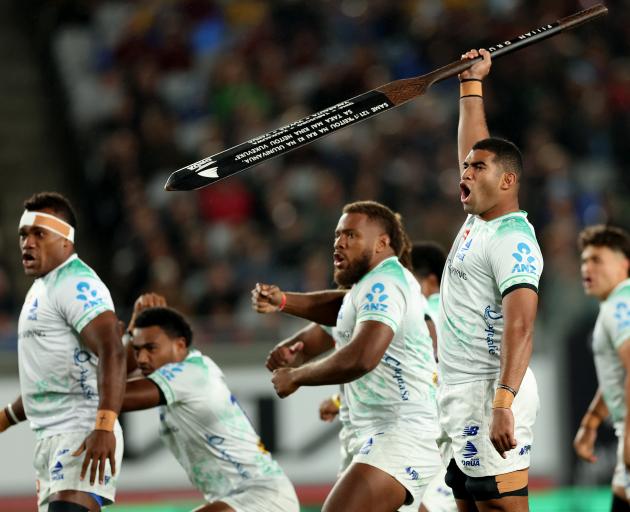 Fijian Drua loose forward Meli Derenalagi leads "Na Bole", the team’s pre-game challenge, before...