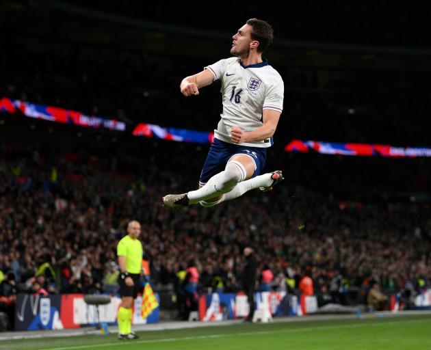 Taylor Harwood-Bellis gets some NBA-like air while celebrating his goal for England against...