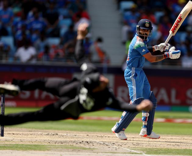 India’s Virat Kohli  looks on as he is caught out by the Black Caps’ Glenn Phillips during the...