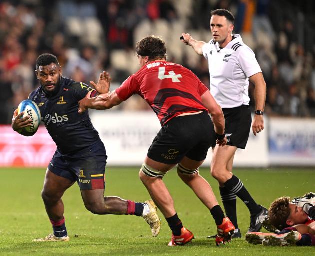 Highlanders inside back Timoci Tavatavanawai (left) keeps Crusaders lock Scott Barrett at bay in...