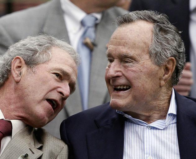 George W Bush (left) with George H.W. Bush. Photo: Getty Images