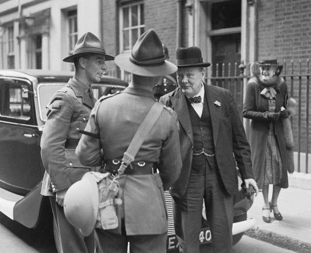 British Prime Minister Winston Churchill chats with two New Zealand soldiers in London in 1940. Photo: Getty Images 