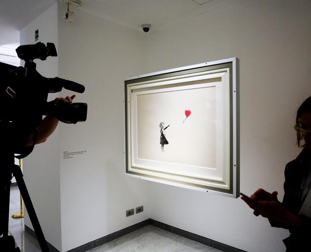 Banksy's Girl and Balloon on show in Rome. Photo: Getty Images 