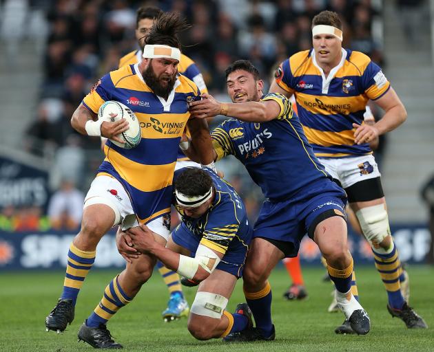 The progress of Bay of Plenty hooker Joe Royal is about to be halted by Otago lock Tom Franklin ...
