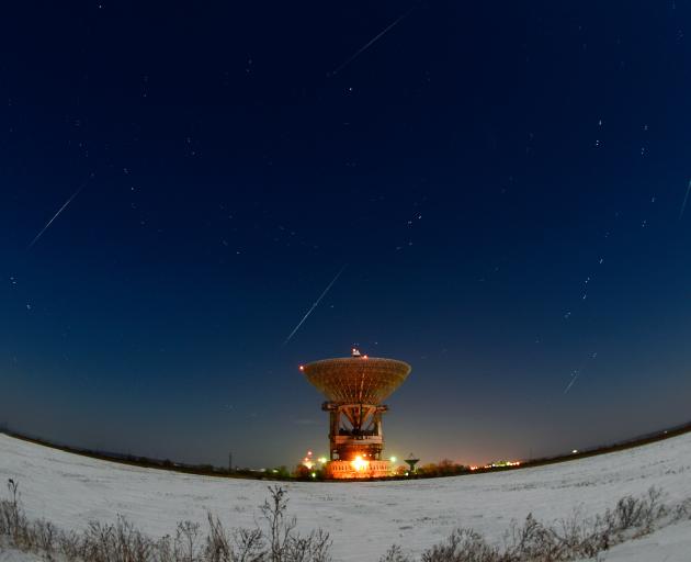 Geminid Meteors streak across the night sky in Eastern Russia last year. Photo: Getty Images 