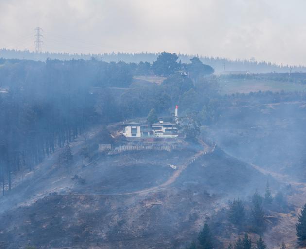 A house stands amid charred land. Photo: Getty Images 