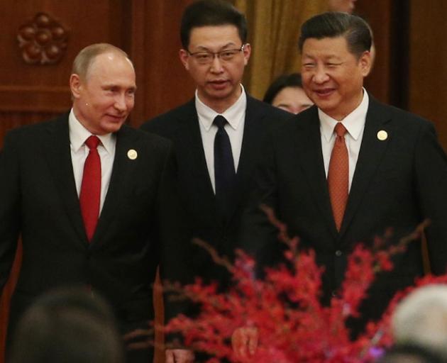 Russian President Vladimir Putin (left) and Chinese President Xi Jinping (right) at the Belt and...