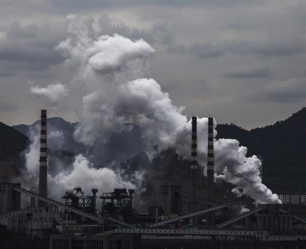 Smoke and steam billows from a state-owned steel plant in China. Photo: Getty Images