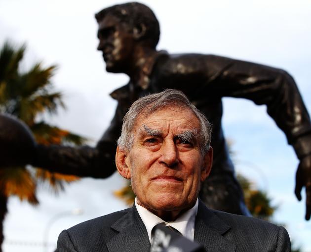 Sir Colin Meads in front of the statue of himself in Te Kuiti in June. Photo: Getty Images 