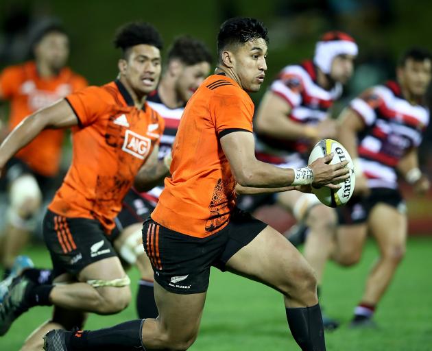 All Black wing Rieko Ioane makes a break against Taranaki during the Game of Three Halves in...