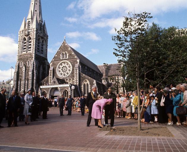 Queen Elizabeth II plants a commemorative tree in Cathedral Square during her Silver Jubilee tour...