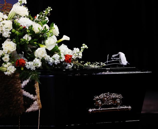 Sir Colin Meads' All Black caps was placed on his coffin. Photo: Getty Images 