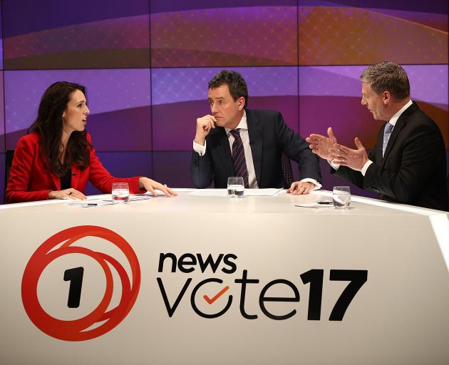 Mike Hosking (centre) chairs debate between Labour leader Jacinda Ardern and National's Bill...