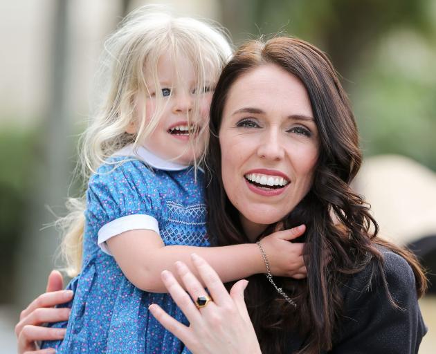 Jacinda Ardern with her partner's niece, Rosie Cowan, on the day of her swearing-in ceremony last...