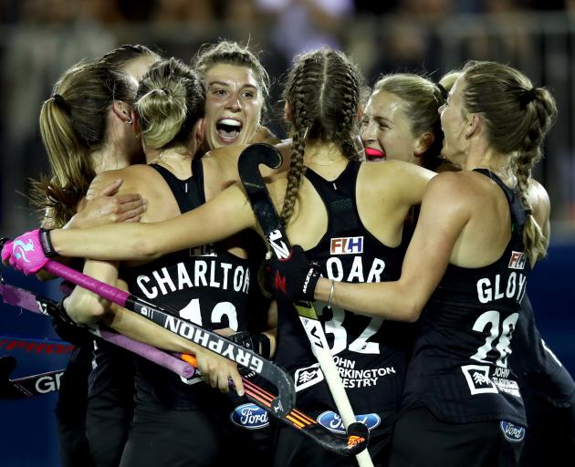 The Black Sticks celebrate after Olivia Merry's (centre) match-winning goal. Photo: Getty Images