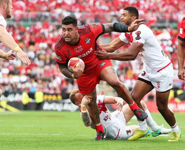 Tonga's Andrew Fifita heads for the tryline last night at Mt Smart Stadium. Photo: Getty Images