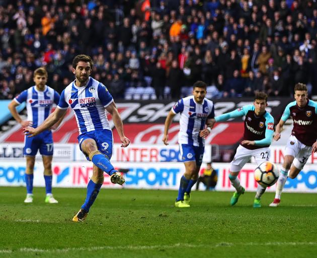 Will Grigg scores Wigan's second goal. Photo: Getty Images 