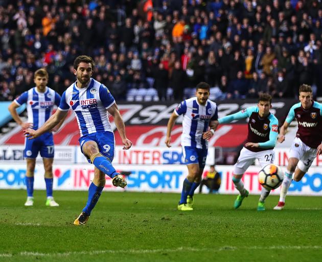 Will Grigg scores Wigan's second goal. Photo: Getty Images