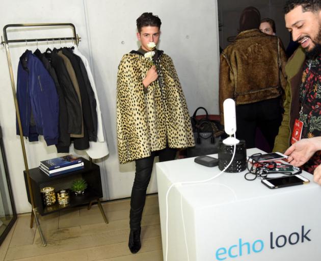 People at New York Fashion Week last year try out Amazon Echo Look. PHOTO: GETTY IMAGES
