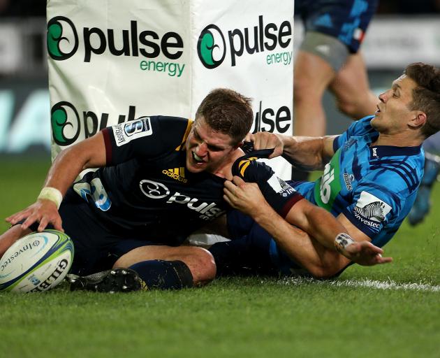 Teihorangi Walden score a try in the tackle of Matt Duffie. Photo: Getty Images