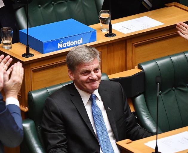 An emptional Bill English is applauded after delivering his valedictory speech in Parliament...