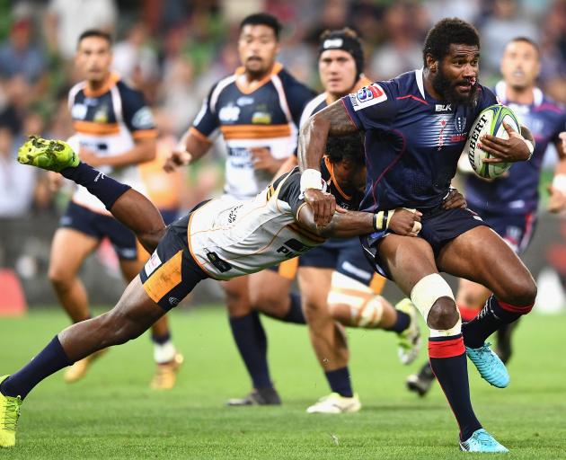 Rebels player Marika Koroibete breaks through a tackle. Photo: Getty Images 