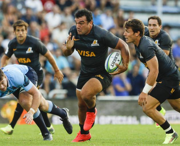 Agustin Creevy (centre) powers on for the Jaguares. Photo: Getty Images 