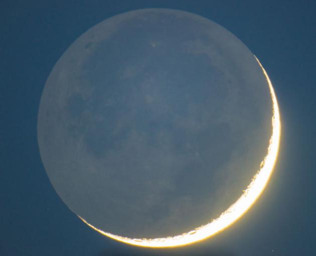 The Moon lit by earthshine. Photo: Getty Images 