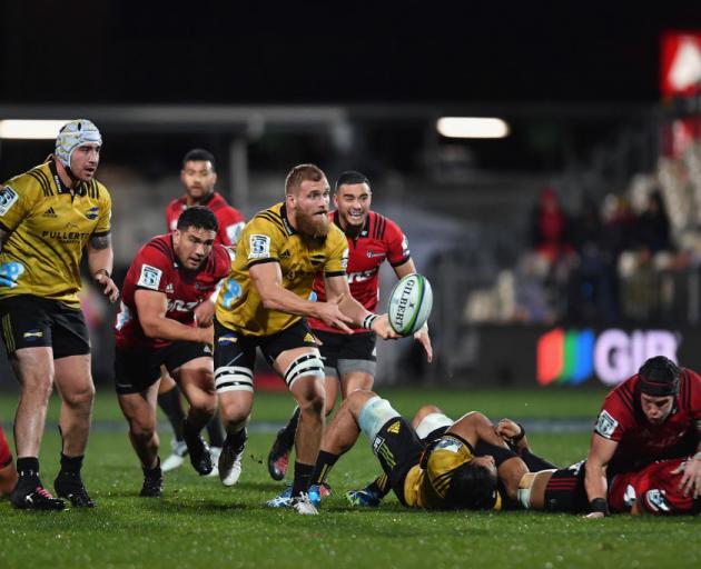 Hurricanes captain Brad Shields clears the ball during an earlier clash with the Crusaders in May...