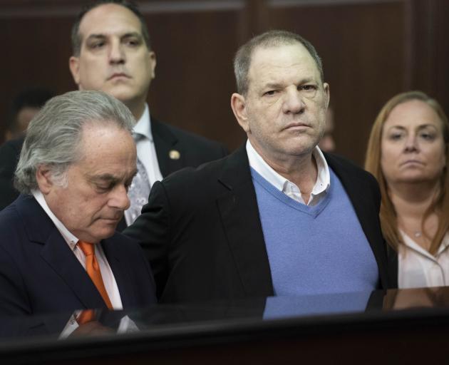 Harvey Weinstein (centre) with attorney Benjamin Brafman (left) appears at his arraignment in...
