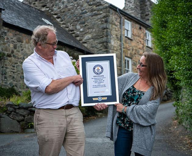 Gwyn Headley and Sarah Badham admire their Guinness World Record certificate stating that Ffordd...