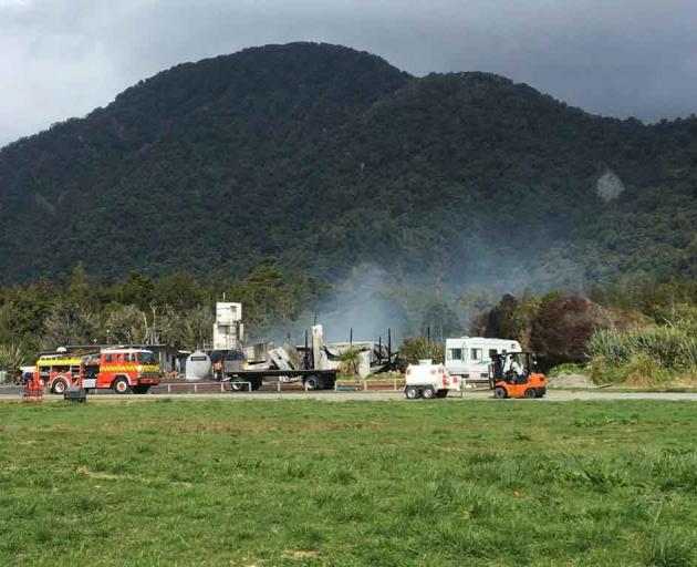 The smouldering remains of the building at Neils Beach today. Photo: Mark Price 
