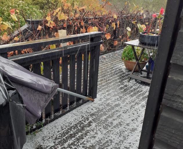 Hailstones cover a deck in Waikouaiti from early this afternoon. Photo: Supplied